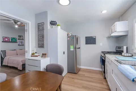 a bedroom with furniture and a chandelier