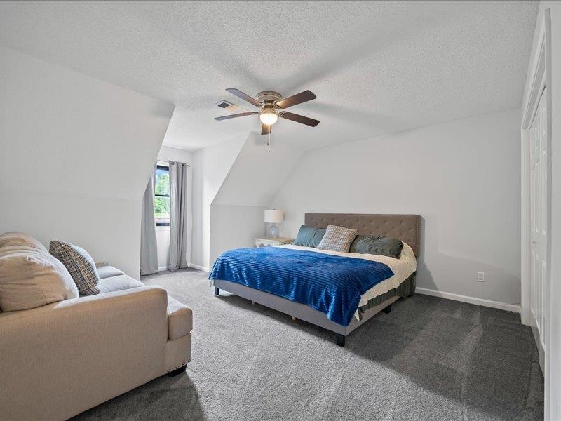 8104 Jack Bond Road Arlington, TN 38002 - Photo 22 of 40 a living room with furniture a ceiling fan and a rug