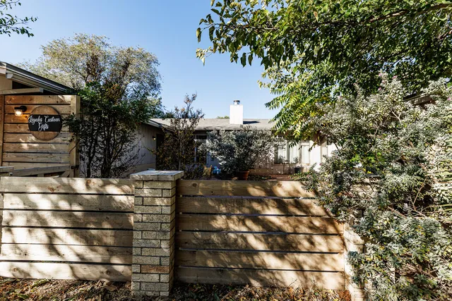 a view of a pathway with a yard