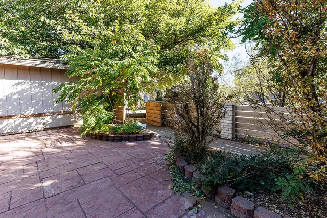 a backyard of a house with lots of green space