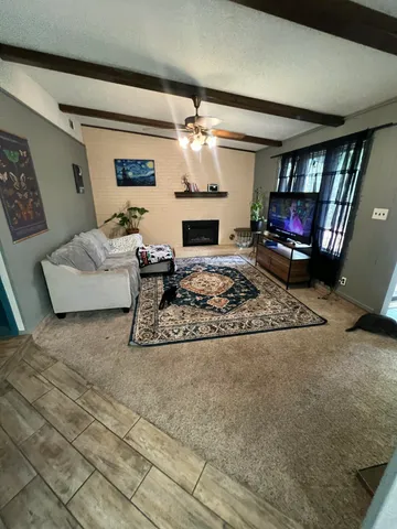 a table with wine bottles and glasses on it