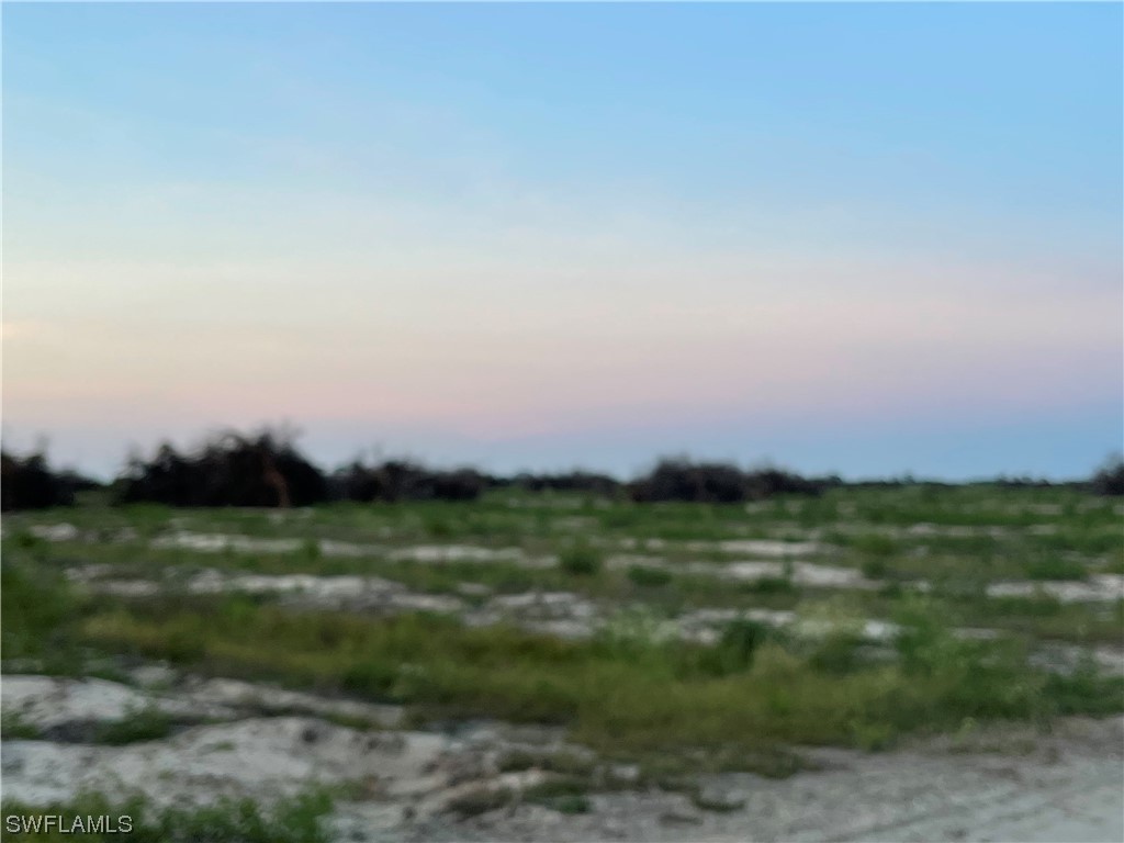 6520 6th Road LaBelle, FL 33935 - Photo 5 of 7 a view of a green field with an outdoor space
