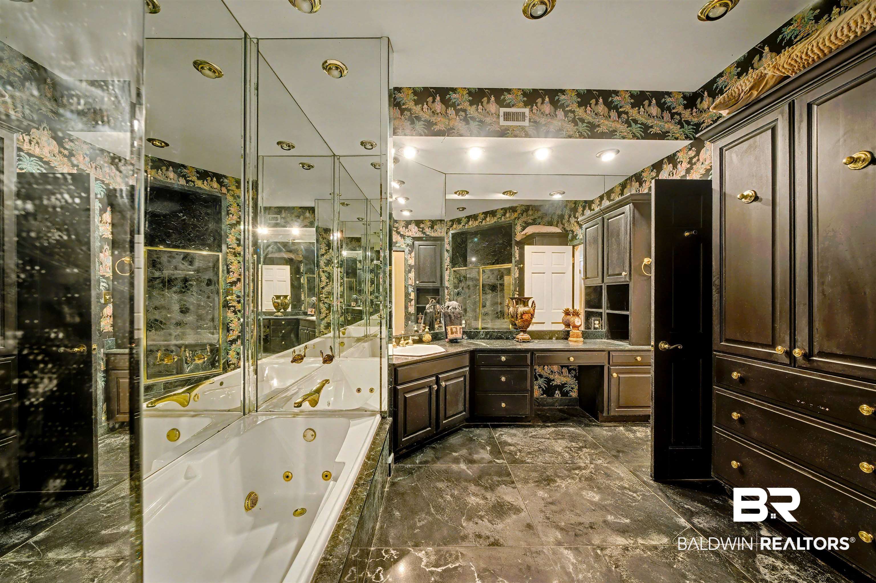 15810 County Road 73 Foley, AL 36535 - Photo 29 of 56 Full bathroom featuring a whirlpool tub, vanity, and dark marble finish floors