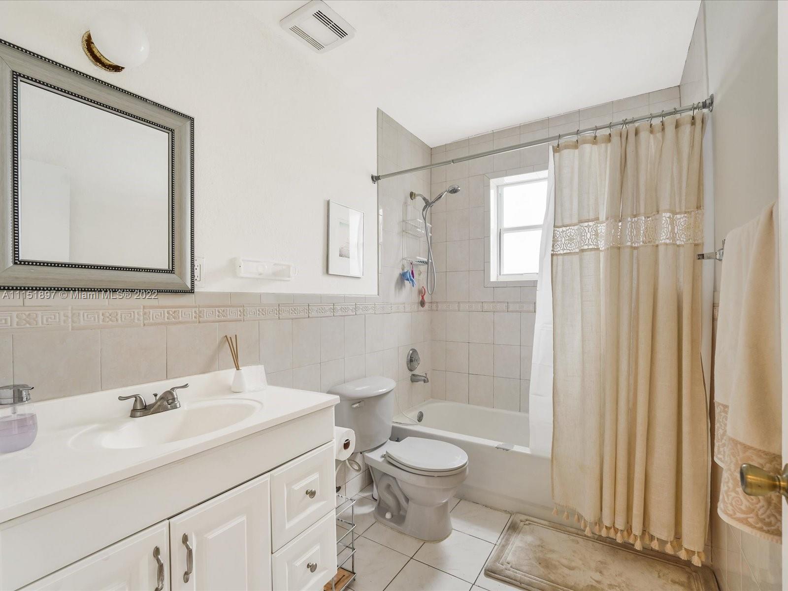 23 Northeast 46th Street Miami, FL 33137 - Photo 14 of 27 a bathroom with a sink a toilet and shower