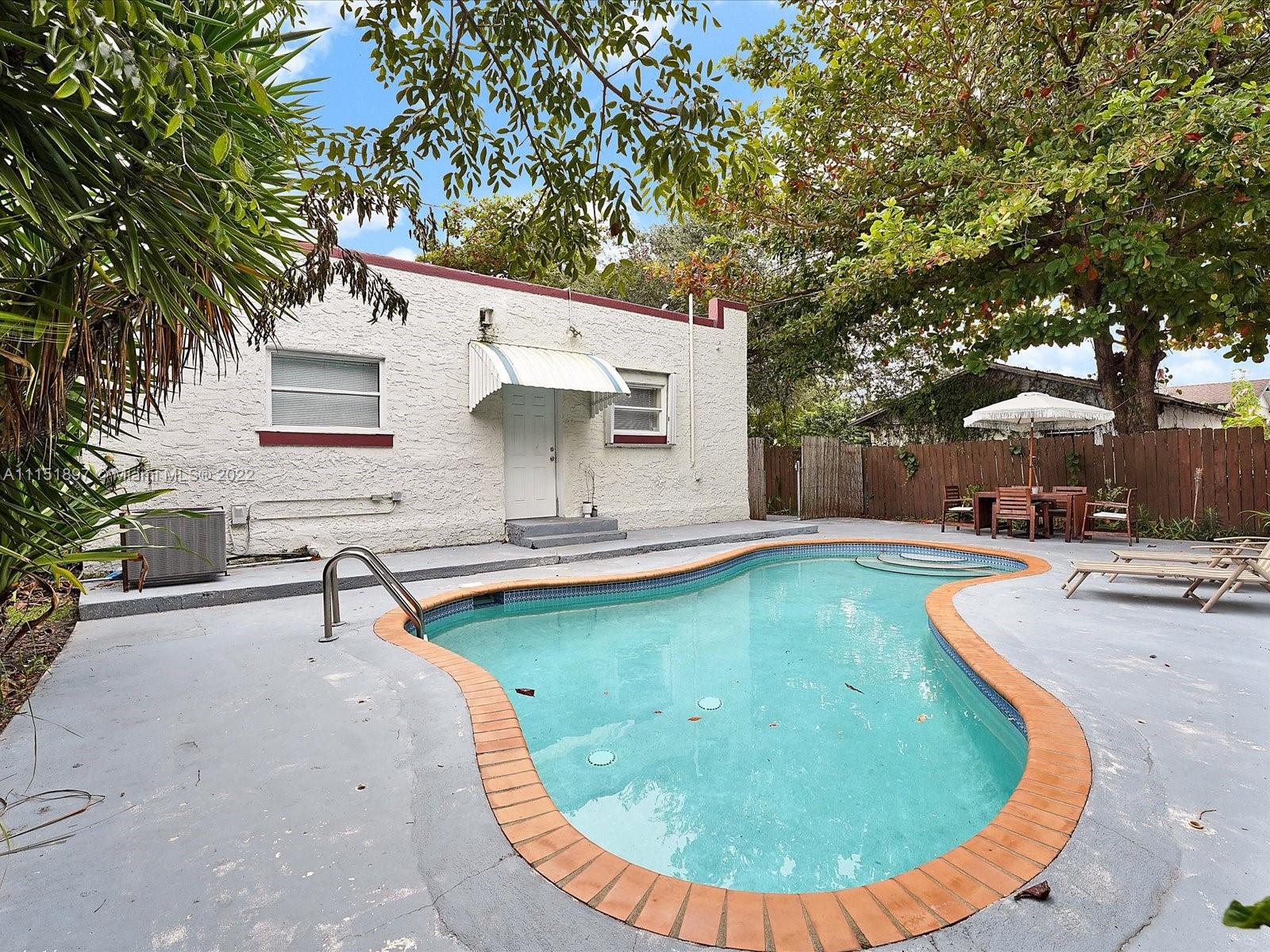 23 Northeast 46th Street Miami, FL 33137 - Photo 18 of 27 swimming pool view with a outdoor seating