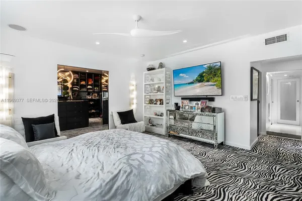 a bedroom with a bed and dresser