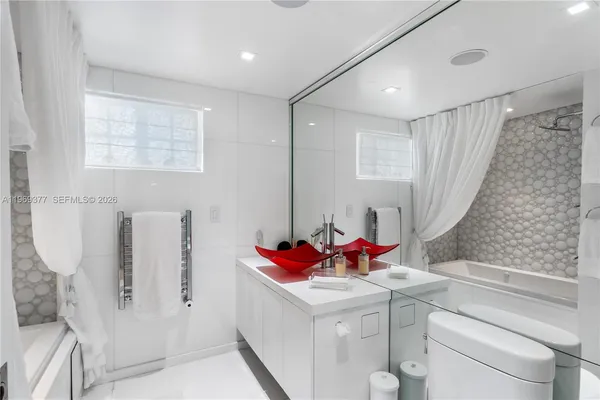 a bathroom with a sink and a shower