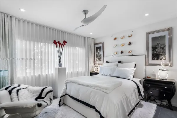 a bedroom with bed and a window