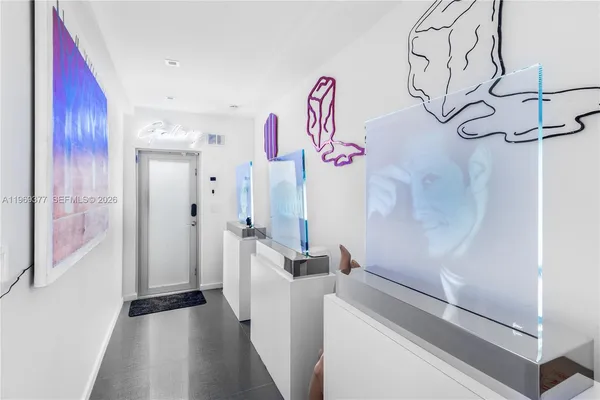 a view of a hallway with windows