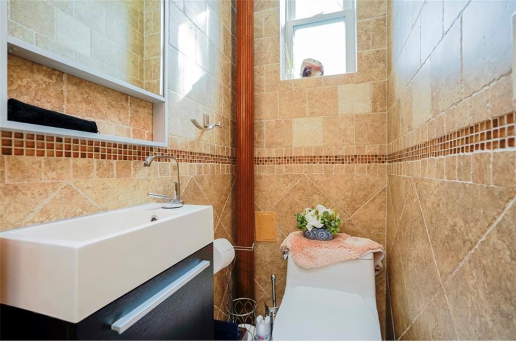 2623 Ave Y Brooklyn, NY 11235 - Photo 14 of 35 a bath room with a sink and a bath tub