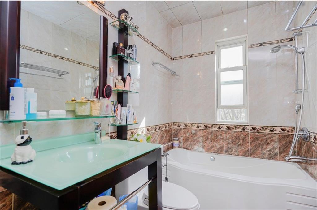 2623 Ave Y Brooklyn, NY 11235 - Photo 20 of 35 a bathroom with a sink and a bathtub