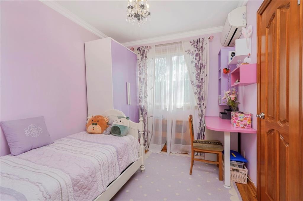 2623 Ave Y Brooklyn, NY 11235 - Photo 21 of 35 a bedroom with a bed and a table