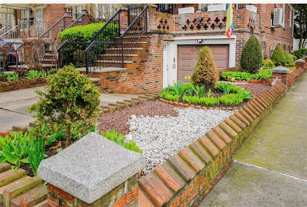 2623 Ave Y Brooklyn, NY 11235 - Photo 34 of 35 a front view of a house with garden