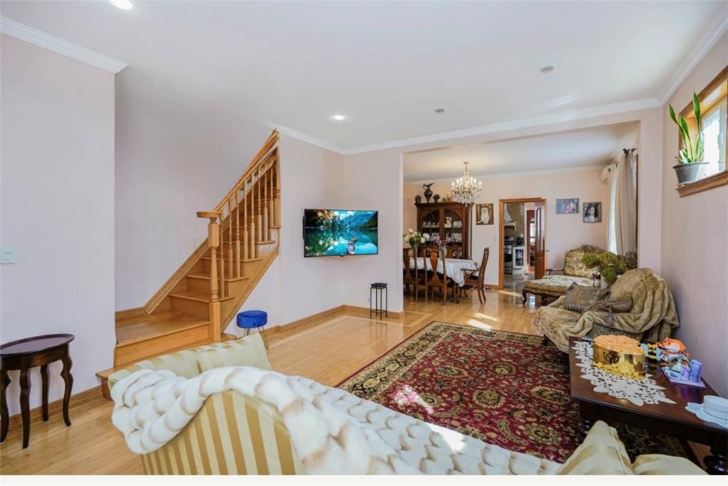 2623 Ave Y Brooklyn, NY 11235 - Photo 6 of 35 a living room with furniture and wooden floor