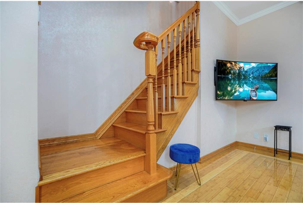 2623 Ave Y Brooklyn, NY 11235 - Photo 7 of 35 a view of staircase with furniture and stairs