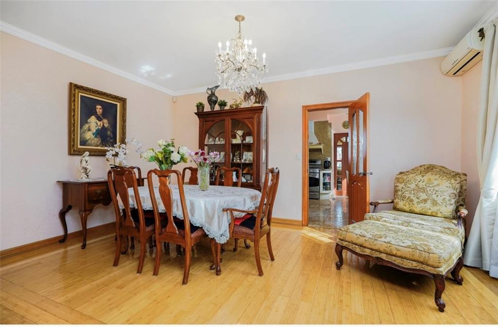 2623 Ave Y Brooklyn, NY 11235 - Photo 9 of 35 a living room with furniture and a chandelier