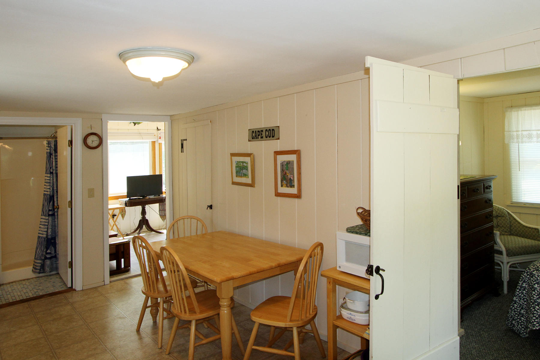 60 Designers Road, Unit A Wellfleet, MA 02667 - Photo 7 of 16 Kitchen into 1st bedroom and sunroom