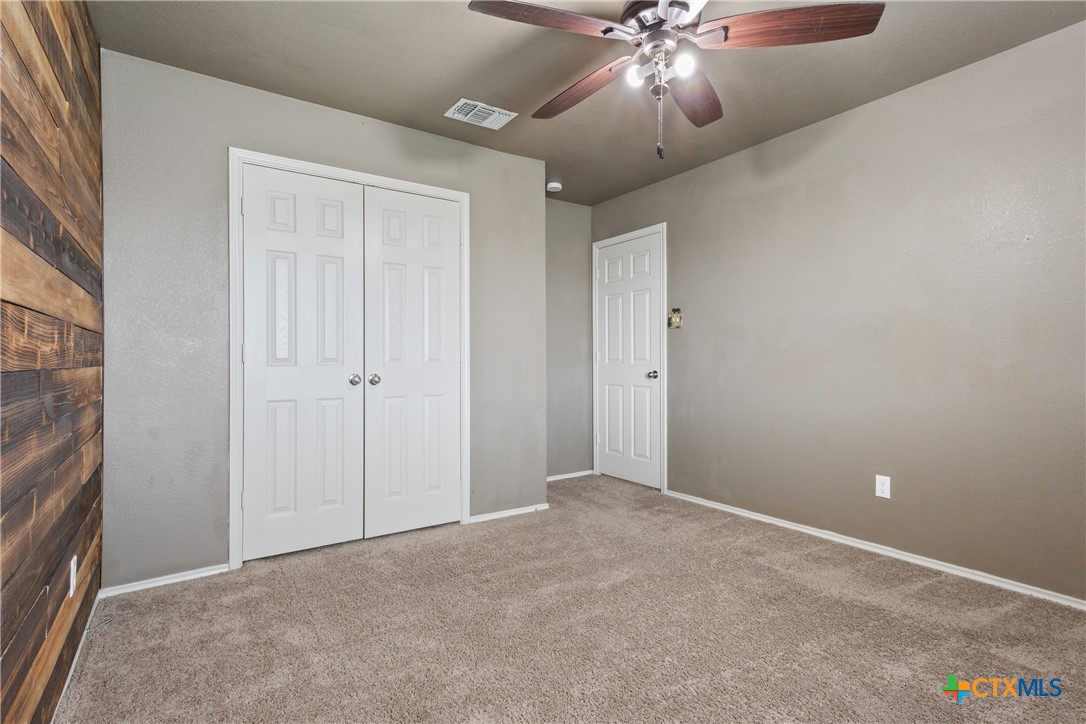 231 Druse Lane Jarrell, TX 76537 - Photo 26 of 38 a view of an empty room and chandelier fan