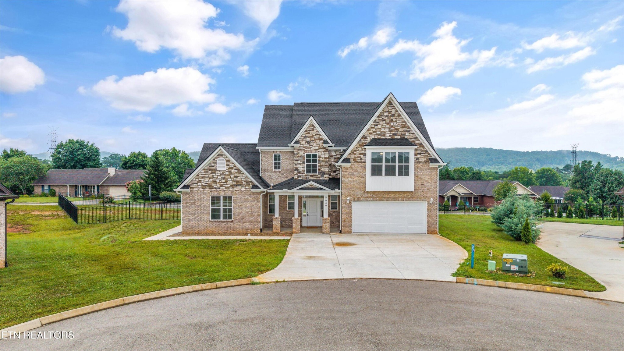 5649 Belle Maison Lane Knoxville, TN 37920 - Photo 1 of 42 a front view of a house with garden