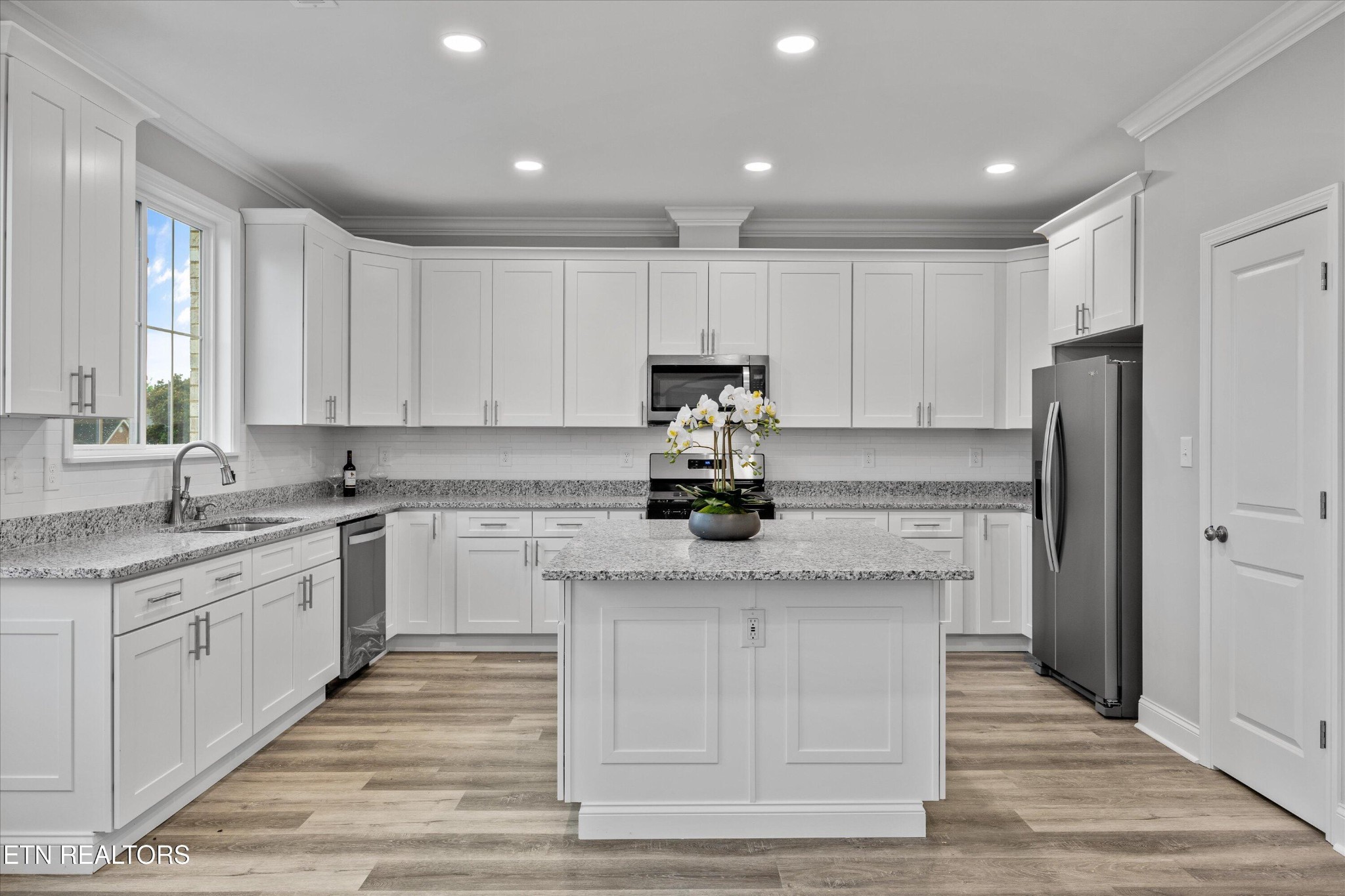 5649 Belle Maison Lane Knoxville, TN 37920 - Photo 12 of 42 a kitchen with stainless steel appliances granite countertop a sink stove and refrigerator