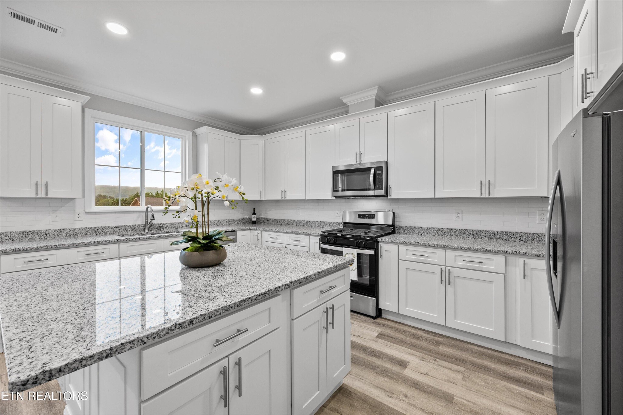 5649 Belle Maison Lane Knoxville, TN 37920 - Photo 13 of 42 a kitchen with sink cabinets and window