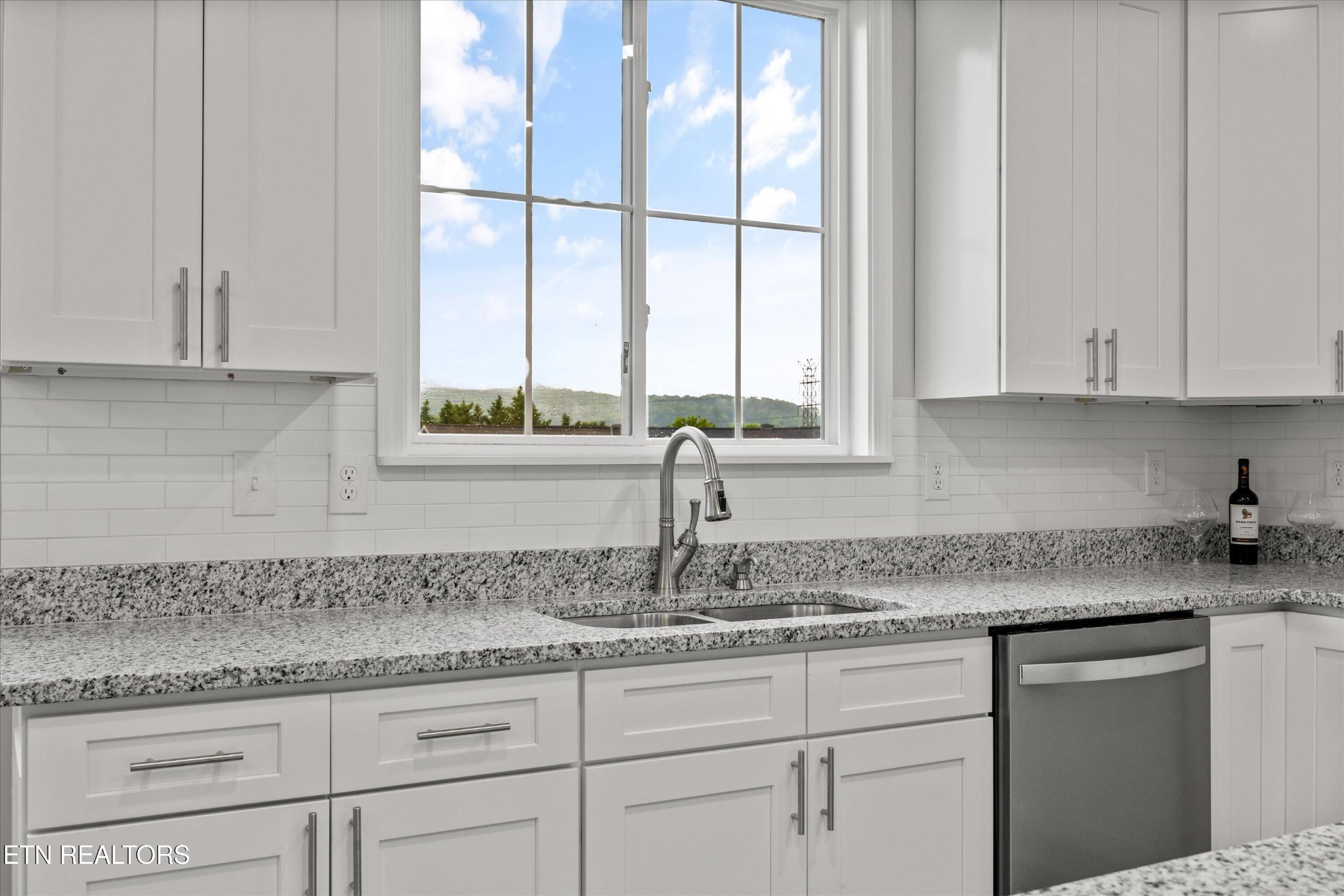5649 Belle Maison Lane Knoxville, TN 37920 - Photo 16 of 42 a kitchen with granite countertop white cabinets and a window