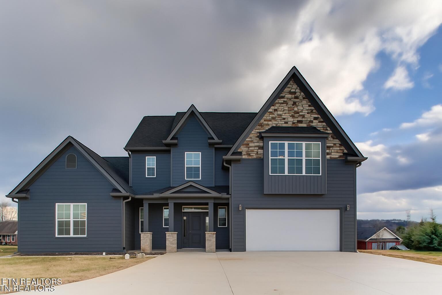 5649 Belle Maison Lane Knoxville, TN 37920 - Photo 2 of 42 a front view of a house with a yard