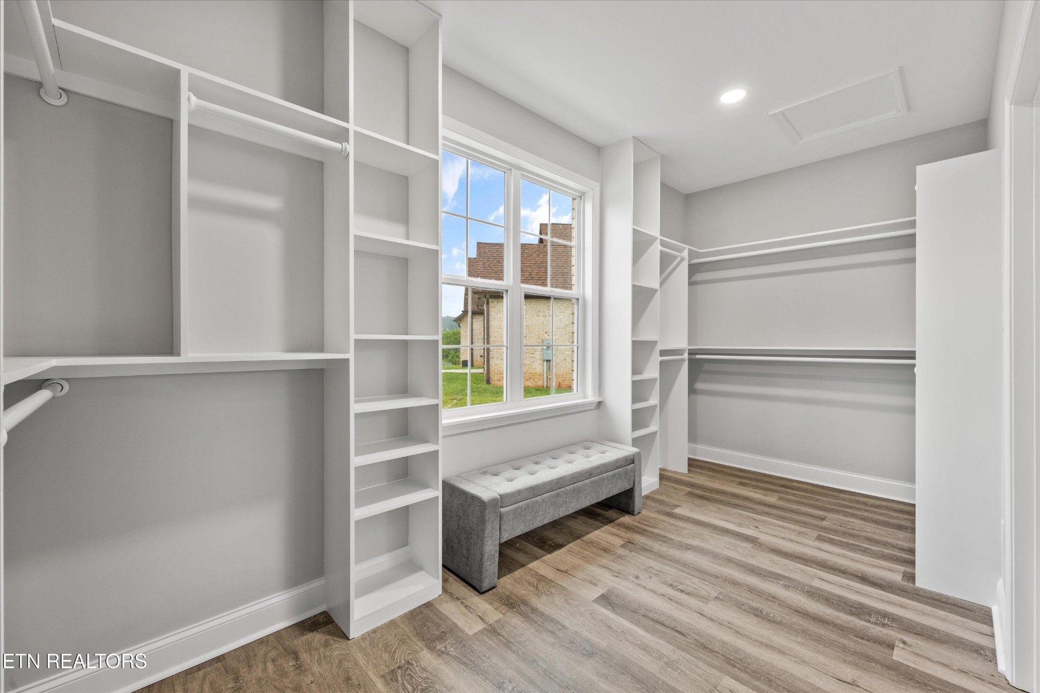 5649 Belle Maison Lane Knoxville, TN 37920 - Photo 22 of 42 a view of an empty room with a window and wooden floor