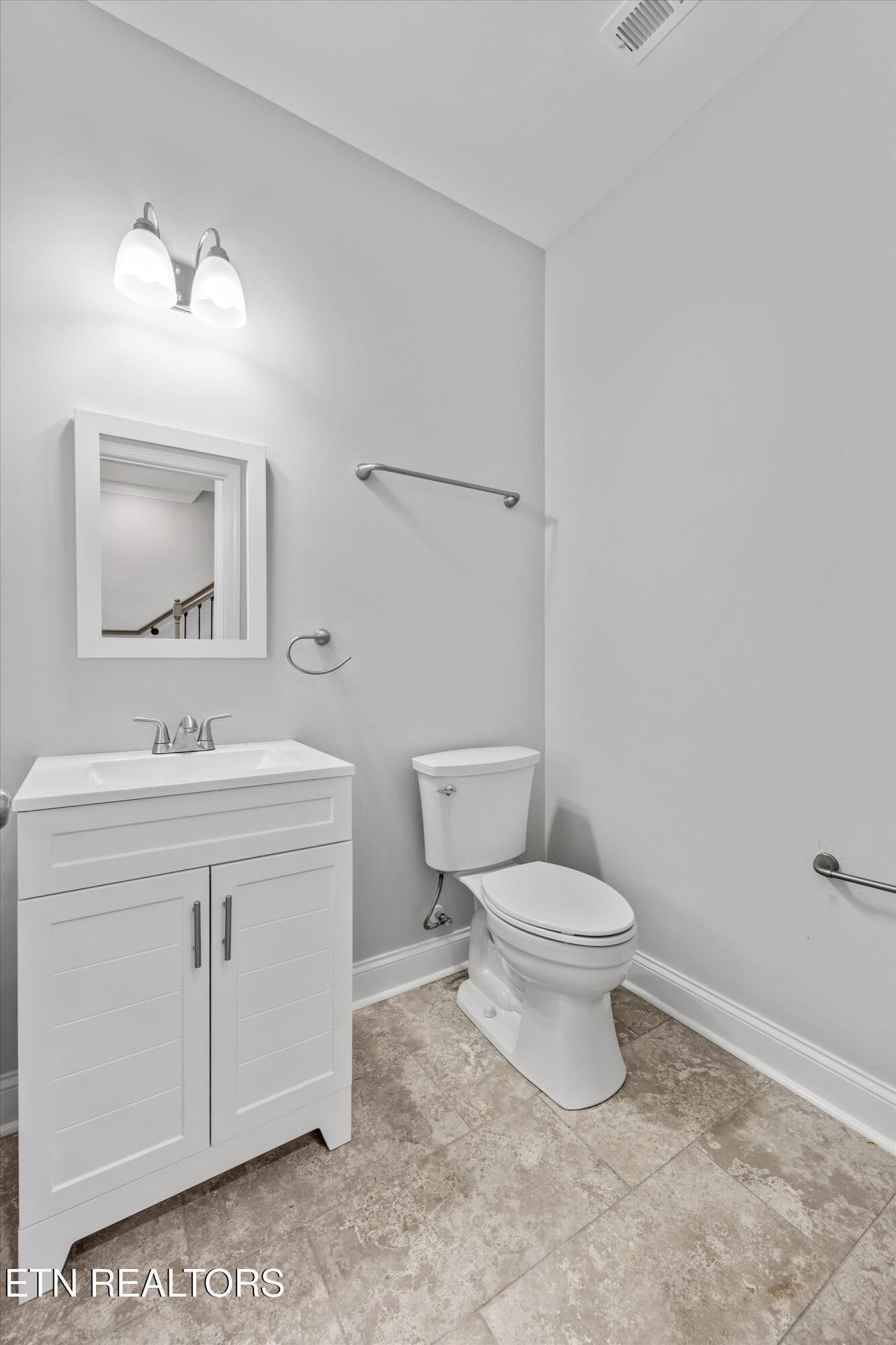 5649 Belle Maison Lane Knoxville, TN 37920 - Photo 23 of 42 a bathroom with a toilet sink and mirror