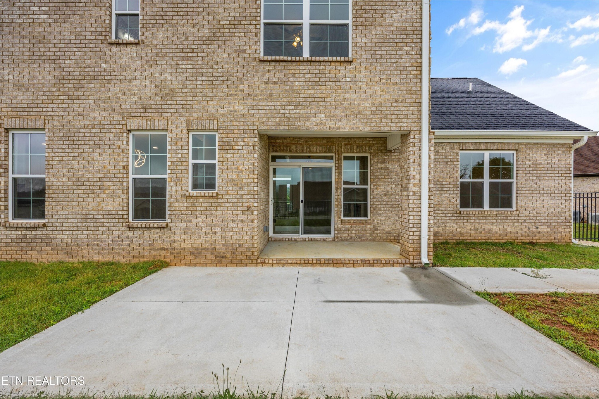 5649 Belle Maison Lane Knoxville, TN 37920 - Photo 33 of 42 a front view of a house with a yard and garage