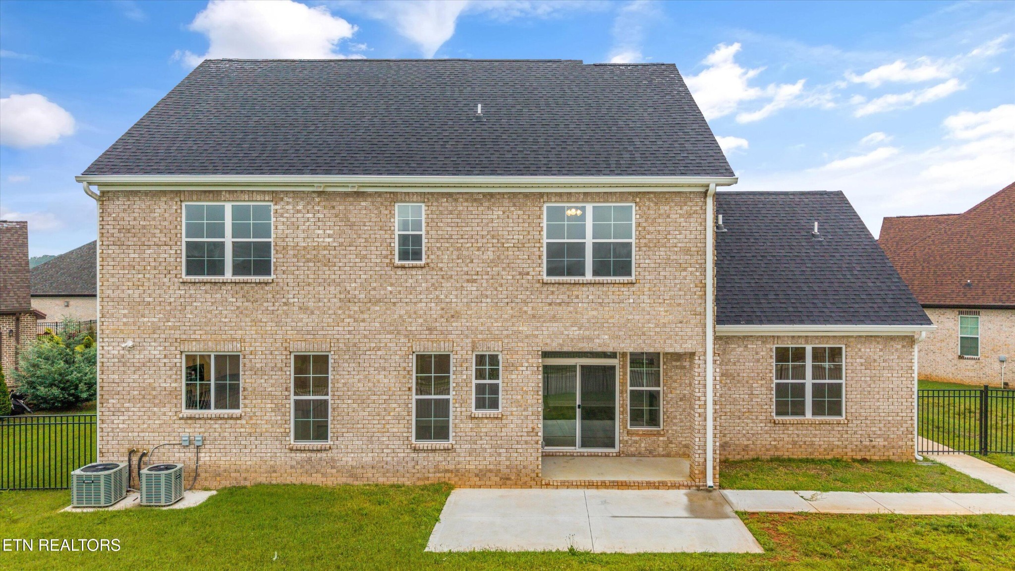 5649 Belle Maison Lane Knoxville, TN 37920 - Photo 34 of 42 a brick house that has a lots of windows in it