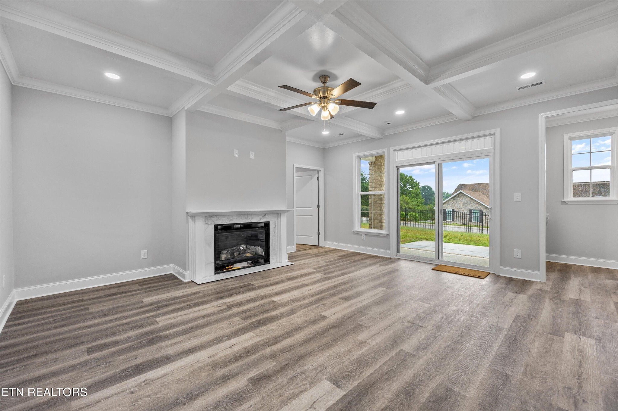 5649 Belle Maison Lane Knoxville, TN 37920 - Photo 7 of 42 a view of an empty room with a fireplace and a window