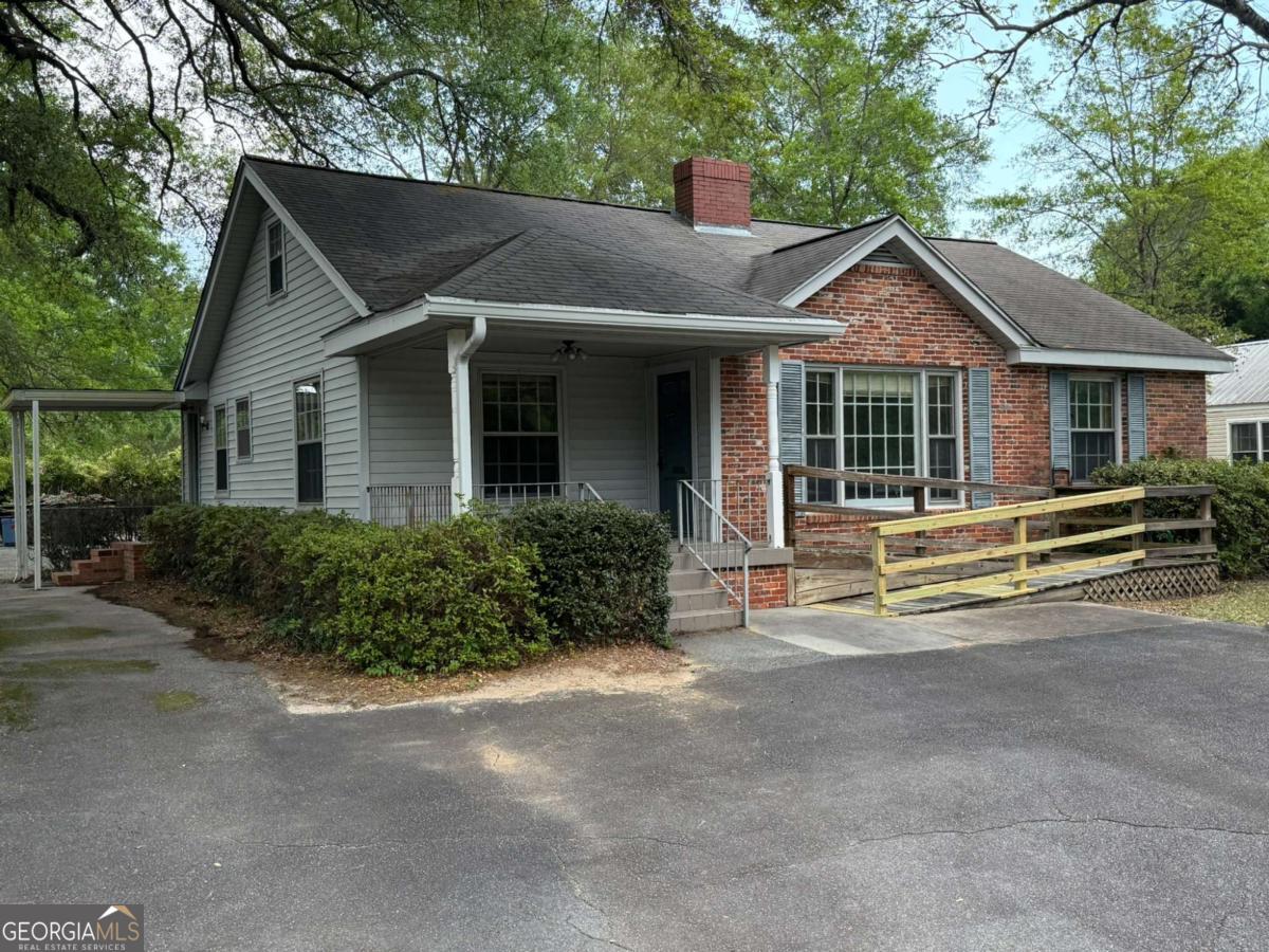109 Vernon Street Dublin, GA 31021 - Photo 2 of 48 a view of a yard in front of house