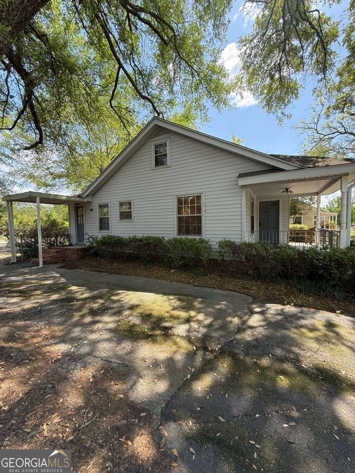 109 Vernon Street Dublin, GA 31021 - Photo 5 of 48 a backyard of a house with yard barbeque oven and outdoor seating
