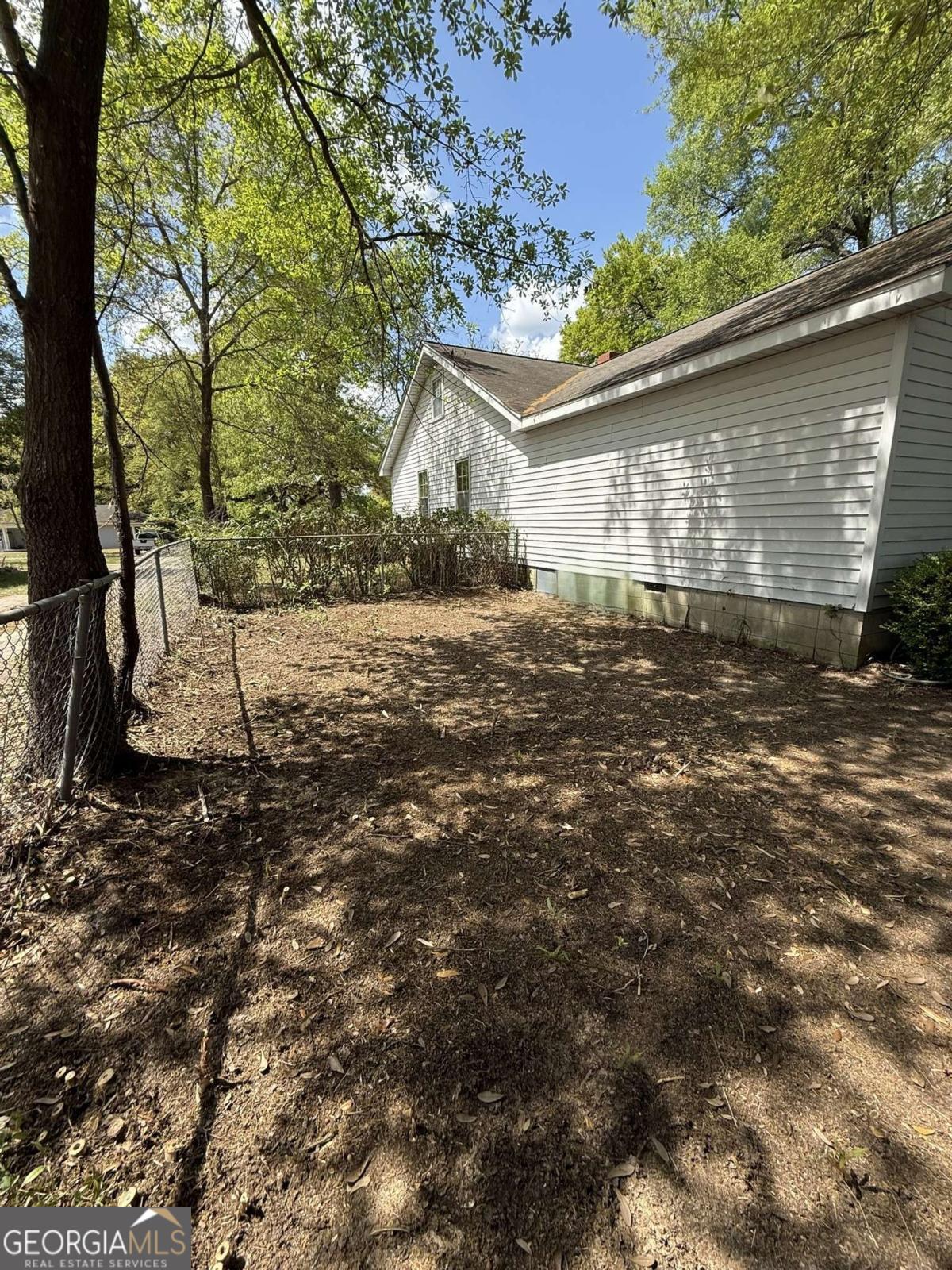 109 Vernon Street Dublin, GA 31021 - Photo 10 of 48 a view of a house with a yard
