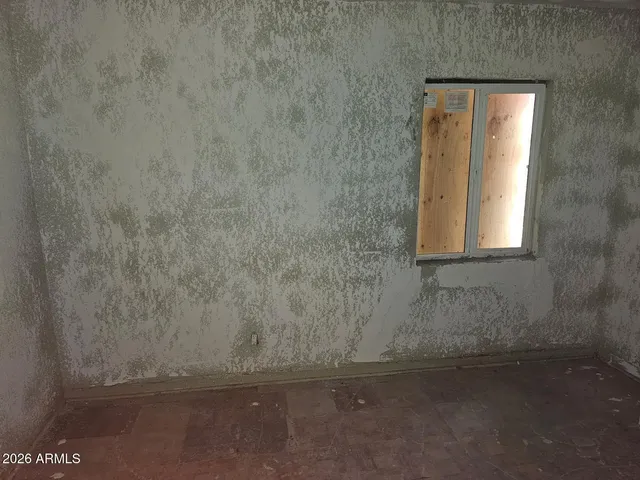 a bathroom with a granite countertop window and a shower