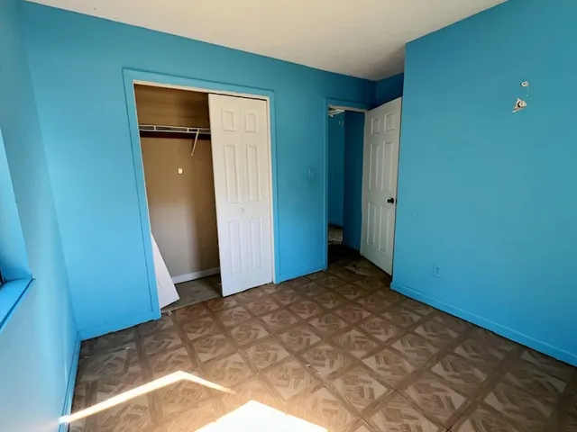 a room with water heater and a window