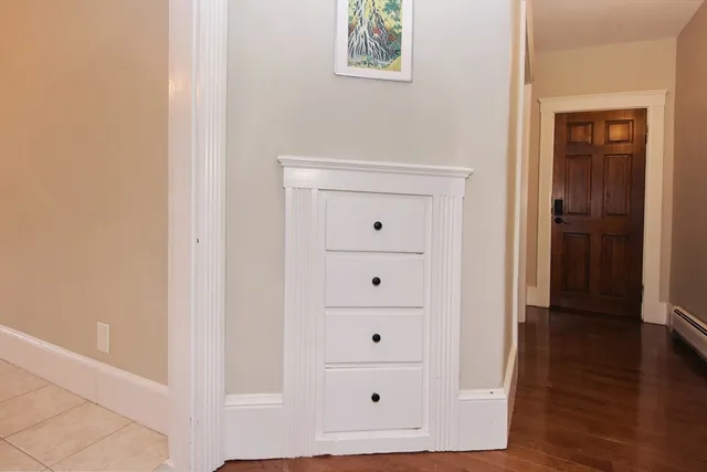 wooden floor with white walls