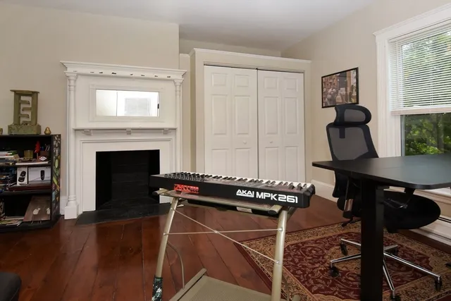 a view of a livingroom with furniture and a fireplace
