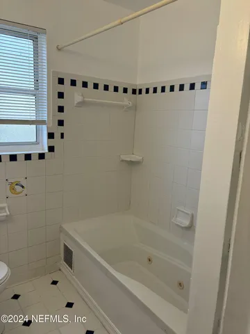 a bathroom with a bathtub