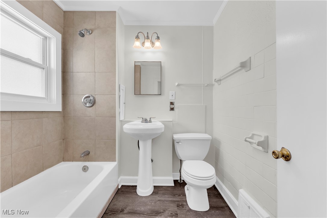 945 Nela View Road Cleveland Heights, OH 44112 - Photo 21 of 27 Full bath featuring crown molding, washtub / shower combination, and dark wood-style floors