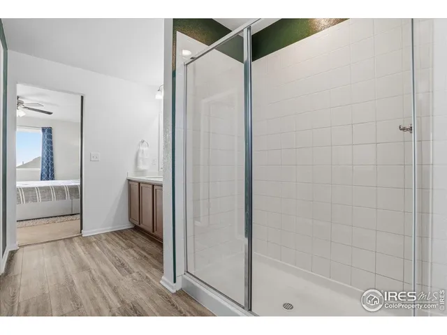 a bedroom with a bed and a cabinet