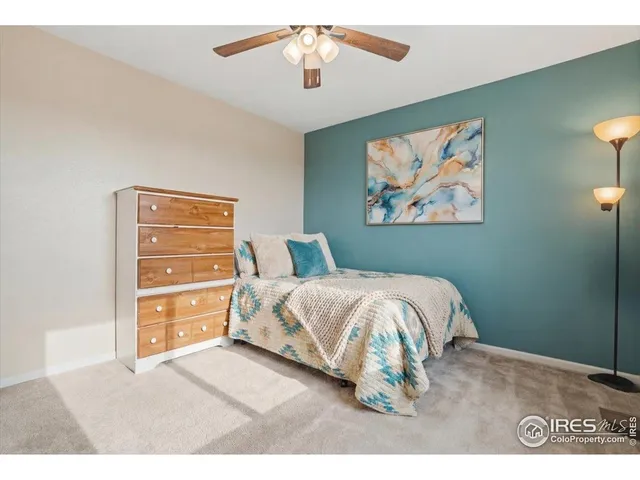 a bathroom with a granite countertop sink toilet a mirror and bathtub