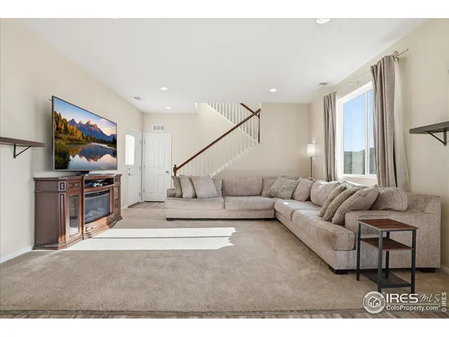 a view of a kitchen with dining table and chairs
