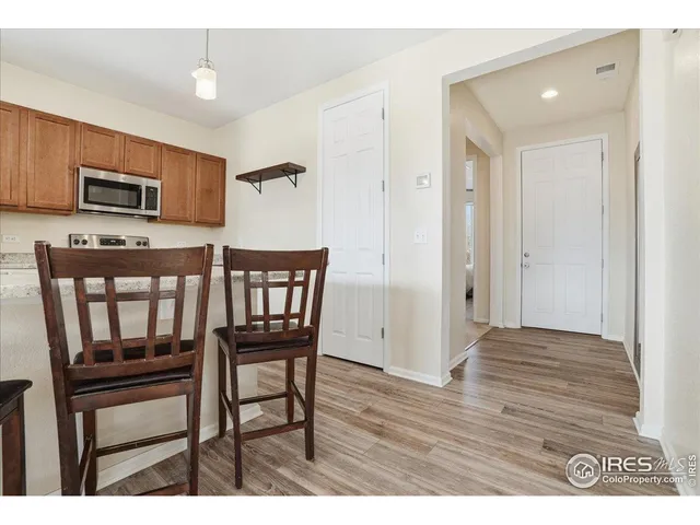 a living room with furniture and a painting