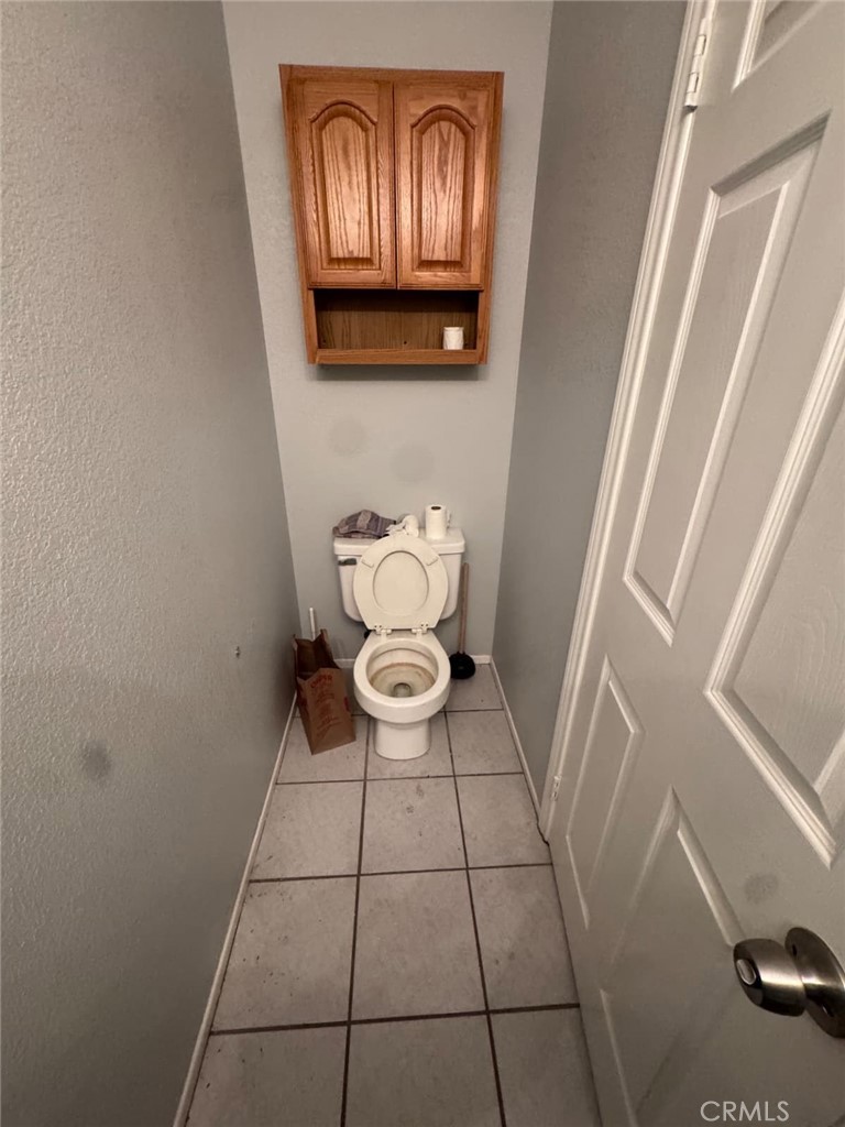 33125 Big Springs Road Acton, CA 93510 - Photo 11 of 11 a bathroom with a toilet and a shower curtain