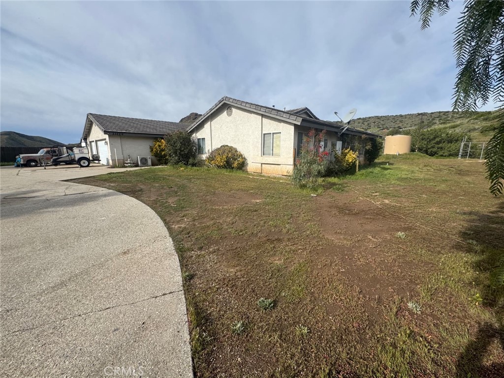 33125 Big Springs Road Acton, CA 93510 - Photo 2 of 11 a front view of a house with a yard