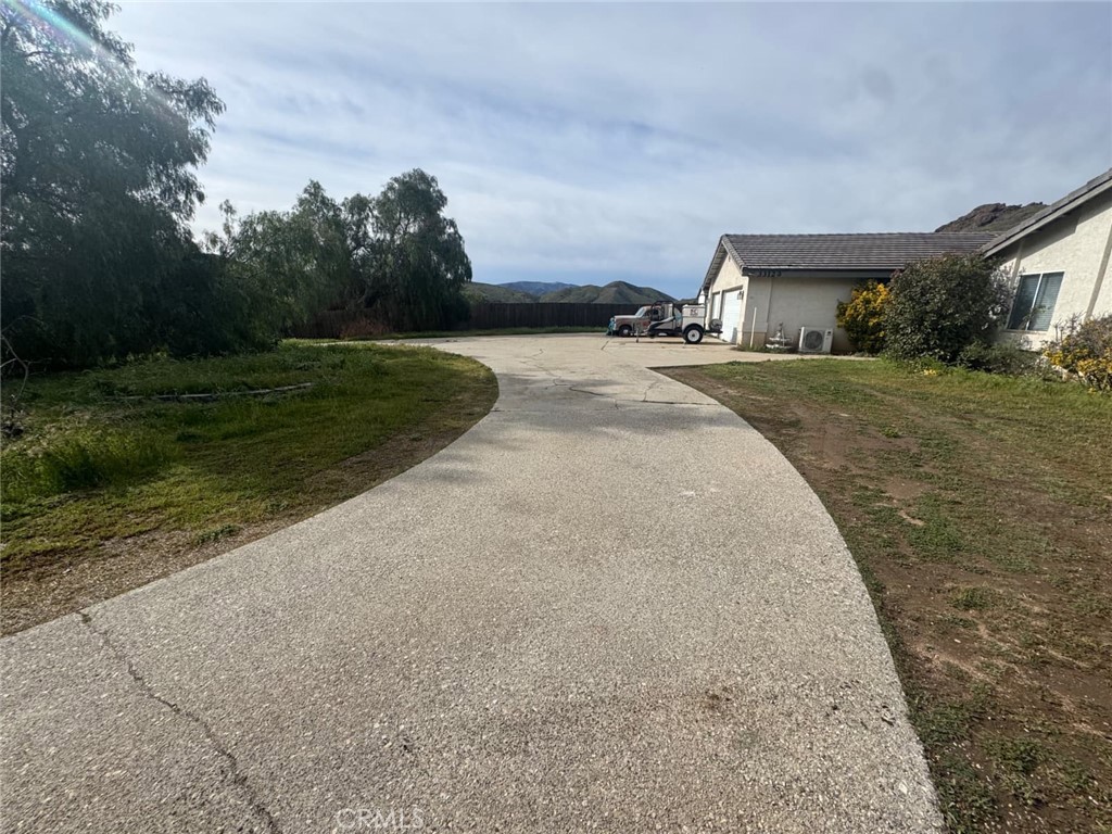 33125 Big Springs Road Acton, CA 93510 - Photo 4 of 11 a front view of a house with a yard