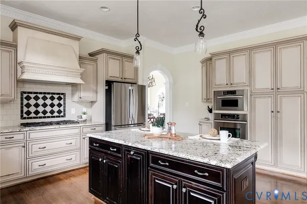 a view of kitchen with wooden floor and electronic appliances