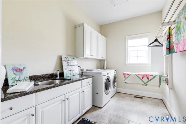 a spacious bathroom with a tub sink and mirror